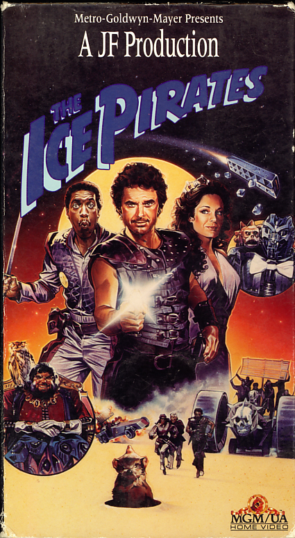 The Ice Pirates VHS cover art. Movie starring Robert Urich, Mary Crosby, Michael D. Roberts, Anjelica Huston, John Matuszak, Ron Perlman. Directed by Stewart Raffill. 1984.