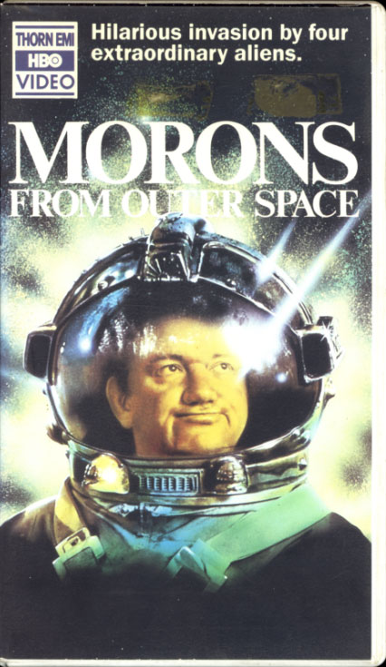 Morons from Outer Space VHS cover art. Movie starring Griff Rhys Jones, Mel Smith, James Sikking, Dinsdale Landen. With Joanne Pearce, Jimmy Nail, Paul Bown. Directed by Mike Hodges. 1985.